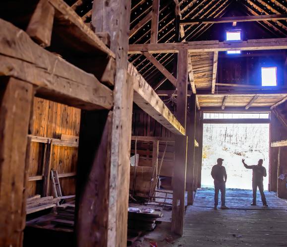 Cedar Mill Group project managers Nick Colarusso (right) and Nick Domenici on the first floor of the red barn the company purchased on Tuesday, April 9, 2024. The fact the barn had a solid roof that kept the rain out of the structure, the barn is solid shape.