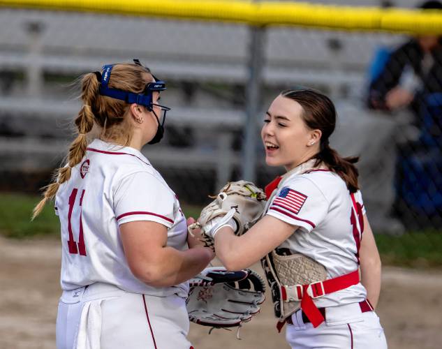 Concord catcher Delaney Duford congratulates pitcher Maddy Wachter after the game on Wednesday, April 17, 2024. Concord won, 3-2.