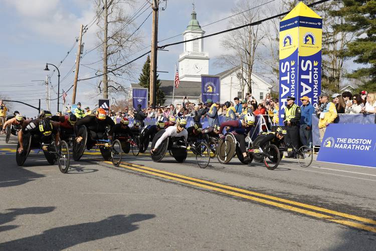 Women's wheelchair athletes break from the line at the start of the Boston Marathon, Monday, April 15, 2024, in Hopkinton, Mass. (AP Photo/Mary Schwalm)