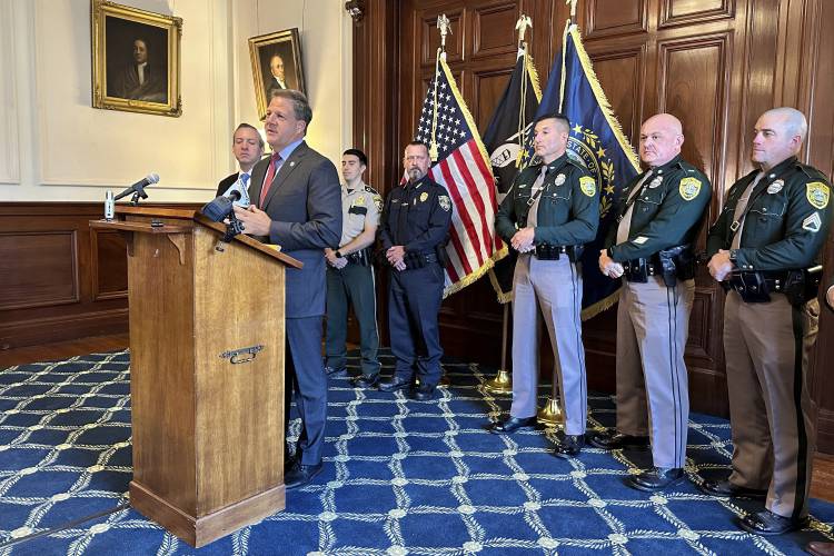 FILE - New Hampshire Gov. Chris Sununu announces details of a new Northern Border Alliance Task Force, Oct. 19, 2023, in Concord, N.H. Police in northern New Hampshire would be allowed to bring trespassing charges against people suspected of illegally entering the U.S. from Canada under a bill approved by the state Senate on Thursday, March 7, 2024. The legislation, which now goes to the House, was requested by Sununu, who created a a task force last year to patrol along the...
