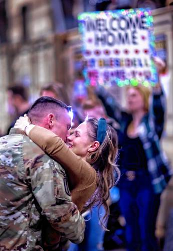 Brielle Torressen and her son, Revere of Belmont welcomes her husband, Captain Andrew Torressen of the New Hampshire Army National Guard 3rd Battalion, 197th Field Artillery Regiment back from his 10-month deployment to the Middle East at the Manchester Armory on Thursday night, February 8, 2024.