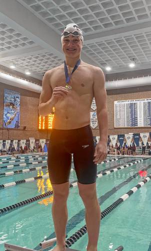 Coe-Brown Northwood Academy’s Tucker Raymond competes at the NHIAA Division II swimming championship at the University of New Hampshire’s Swasey Pool on Saturday. Raymond won both the 100 butterfly and 500 freestyle titles to lead Coe-Brown to third place in D-II.