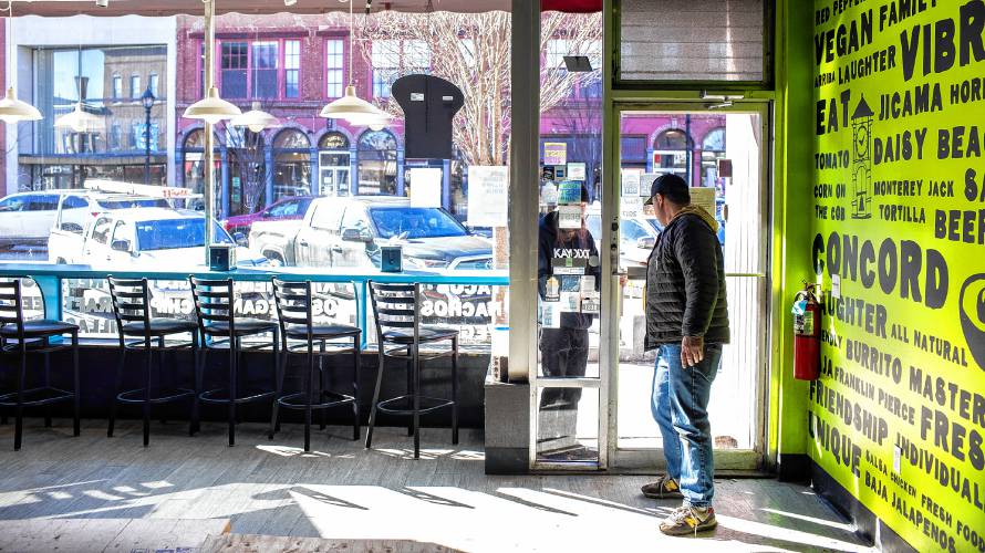 Dos Amigos owner Joel Harris opens the door for an employee at the Main Street restaurant in downtown Concord on Tuesday, February 6, 2024. Harris hopes to re-open sometime next week after they do major renovations to the restaurant.